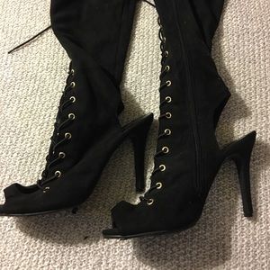 Thigh high laced up heeled boots